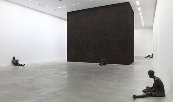 Ugo rondinone, nude, 2011. Wax, earth pigments, steel rods, and polyurethane foam. At centre: standing landscape, 2013. Site-specific. Installation view of Ugo Rondinone, thank you silence, 2013. Museum Leuven. Courtesy of Studio Rondinone and Museum Leuven ©Dirk Pauwelst.